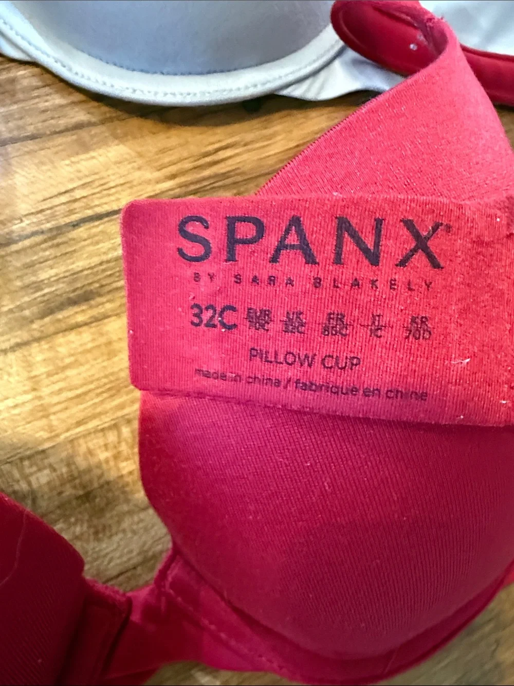 Three-pack SPANX Smooth T-Shirt Bras in Light Blue, Cream, and Red